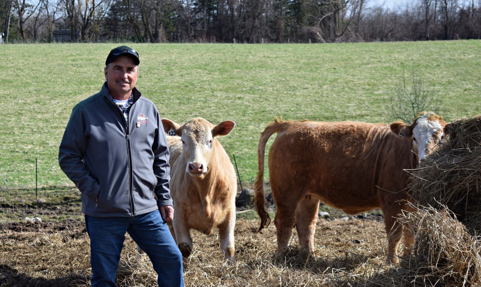 https://thenewfarm.ca/wp-content/uploads/2026/06/Uncle-Jim-with-2-cows-scaled-e1782324885260.jpg